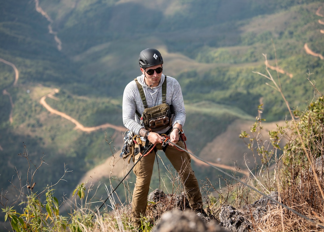 U.S. Army Staff Sgt. Brandon Valverde, Defense POW/MIA Accounting Agency mountaineer, rappels a cliff face during a recovery mission in Laos, Jan. 21, 2026.