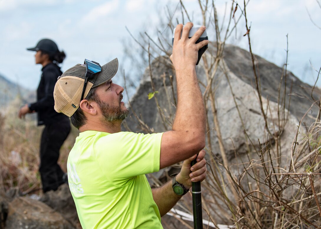 Blake Ayala, Defense POW/MIA Accounting Agency scientific recovery expert, uses a real-time kinetic global navigation satellite system receiver to map an area during a recovery mission in Laos, Jan. 21, 2026.