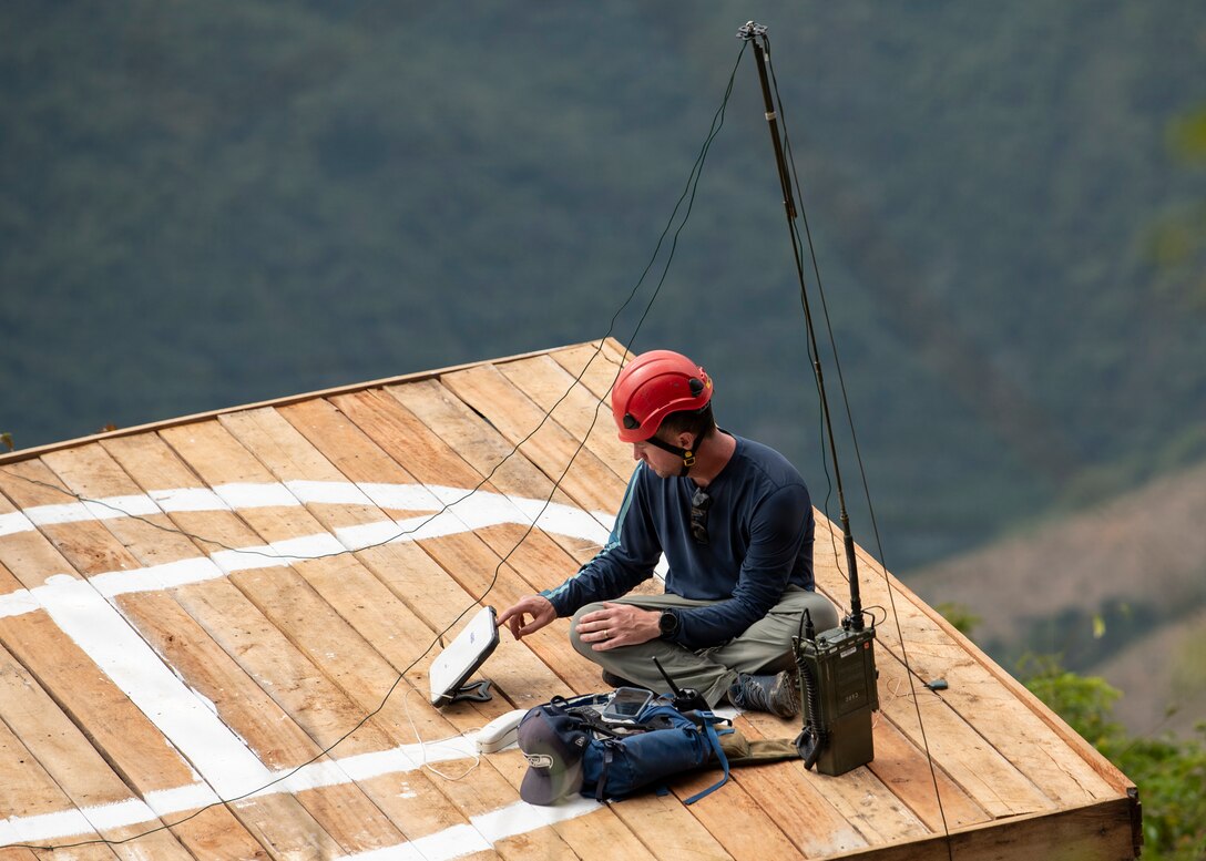 U.S. Air Force Tech. Sgt. Benjamin Chumney, Defense POW/MIA communications specialist, establishes high frequency communications during a recovery mission in Laos, Jan. 22, 2026.