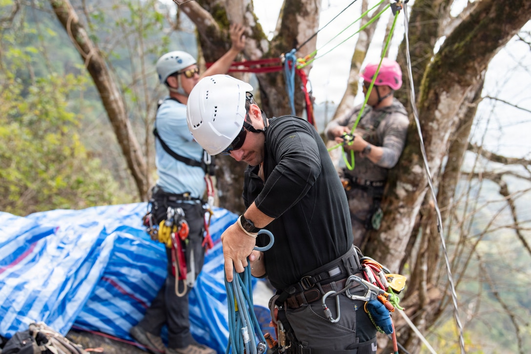 U.S. Army Staff Sgt. Zachary Bailey, Defense POW/MIA Accounting Agency independent duty medical technician, gathers bridal rope before a casualty evacuation rehearsal during a recovery mission in Laos, Jan. 28, 2026.