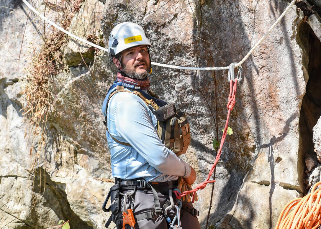 Blake Ayala, Defense POW/MIA Accounting Agency scientific recovery expert, prepares to survey an area during a recovery mission in Laos, Feb. 4, 2026.