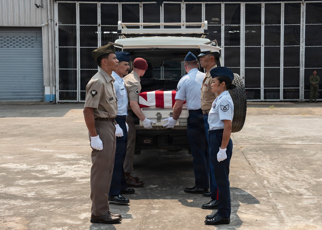 Members of 26-2LA Recovery Team for the Defense POW/MIA Accounting Agency load a casket into a vehicle during a repatriation ceremony in Laos, Feb. 23, 2026.