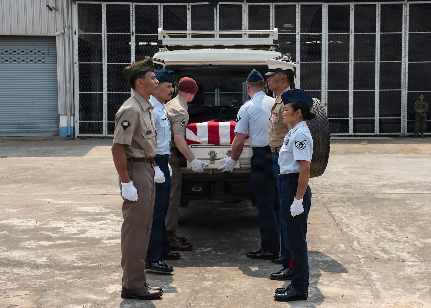 Members of 26-2LA Recovery Team for the Defense POW/MIA Accounting Agency load a casket into a vehicle during a repatriation ceremony in Laos, Feb. 23, 2026.