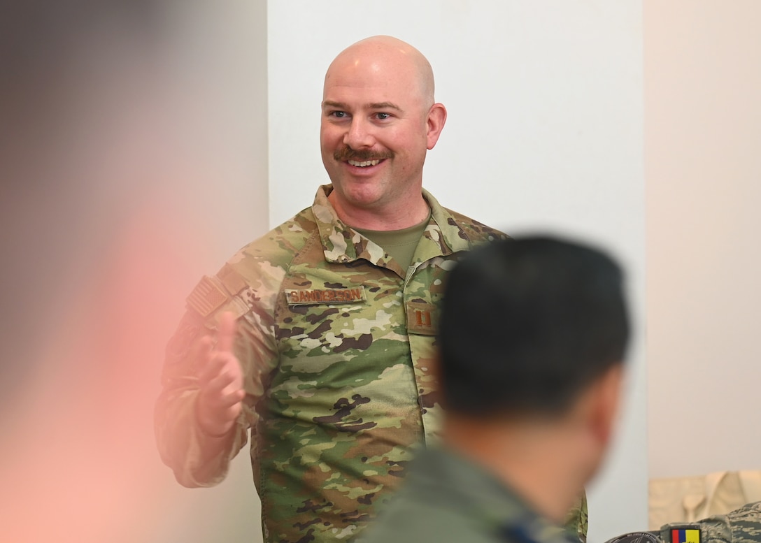 U.S. Air Force Capt. Jason Sanderson, Kentucky Air National Guard bilateral affairs officer, greets the Fuerza Aérea Ecuatoriana (FAE) during the U.S. and Ecuadorian Airman-to-Airman staff talks, at Davis-Monthan Air Force Base, Arizona, March 3, 2026. The State Partnership Program enhances stability across the U.S. Southern Command area of responsibility by connecting National Guard units with partner-nation forces to strengthen collaboration, improve communication, showcase shared capabilities, and cultivate enduring military and civil partnerships. (U.S. Air Force photo by Staff Sgt. Abbey Rieves)