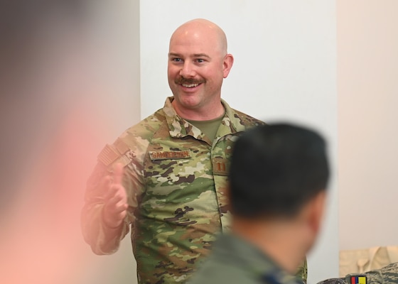 U.S. Air Force Capt. Jason Sanderson, Kentucky Air National Guard bilateral affairs officer, greets the Fuerza Aérea Ecuatoriana (FAE) during the U.S. and Ecuadorian Airman-to-Airman staff talks, at Davis-Monthan Air Force Base, Arizona, March 3, 2026. The State Partnership Program enhances stability across the U.S. Southern Command area of responsibility by connecting National Guard units with partner-nation forces to strengthen collaboration, improve communication, showcase shared capabilities, and cultivate enduring military and civil partnerships. (U.S. Air Force photo by Staff Sgt. Abbey Rieves)