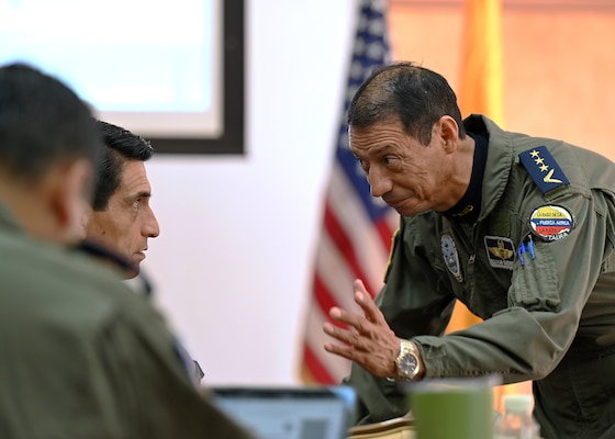 Fuerza Aérea Ecuatoriana (FAE) Col. José Guerrero Piñeiros, Air Forces Southern foreign liaison officer, speaks with fellow FAE members during the U.S. and Ecuadorian Airman-to-Airman staff talks, at Davis-Monthan Air Force Base, Arizona, March 3, 2026. The Airman-to-Airman talks discussed future joint training exercises, project collaborations and cultural exchanges to enhance the skills and understanding between the two partner nations. (U.S. Air Force photo by Staff Sgt. Abbey Rieves)