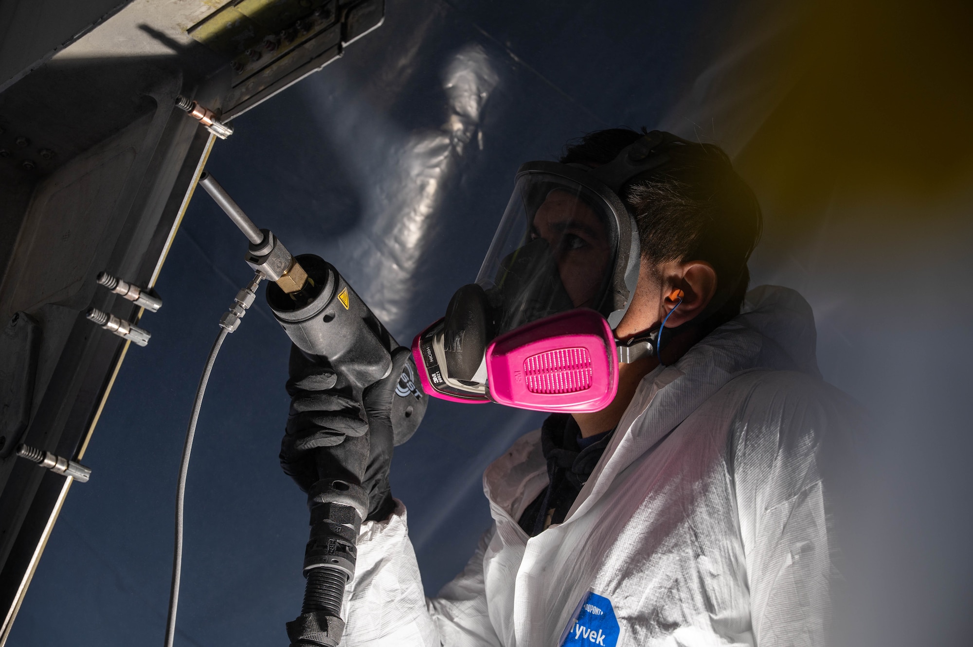 Ryan Kayton, Engineering and Software System Solutions, Inc. mechanical technician, uses cold spray equipment to restore metal on a B-1B Lancer at Dyess Air Force Base, Texas, Feb. 20, 2026. The repair marked the first on-aircraft application of the technique at Dyess. (U.S. Air Force photo by Airman 1st Class William Neal)