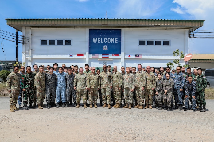 U.S. Army Gen. Xavier T. Brunson, commander of United Nations Command, Combined Forces Command, and U.S. Forces Korea, and Command Sgt. Maj. Robin Bolmer, senior enlisted leader of UNC, CFC, and USFK, pose for a photo with service members from the U.S., Singapore, Indonesia, South Korea, Japan, and Thailand at Camp Red Horse, Thailand, March 2, 2026.