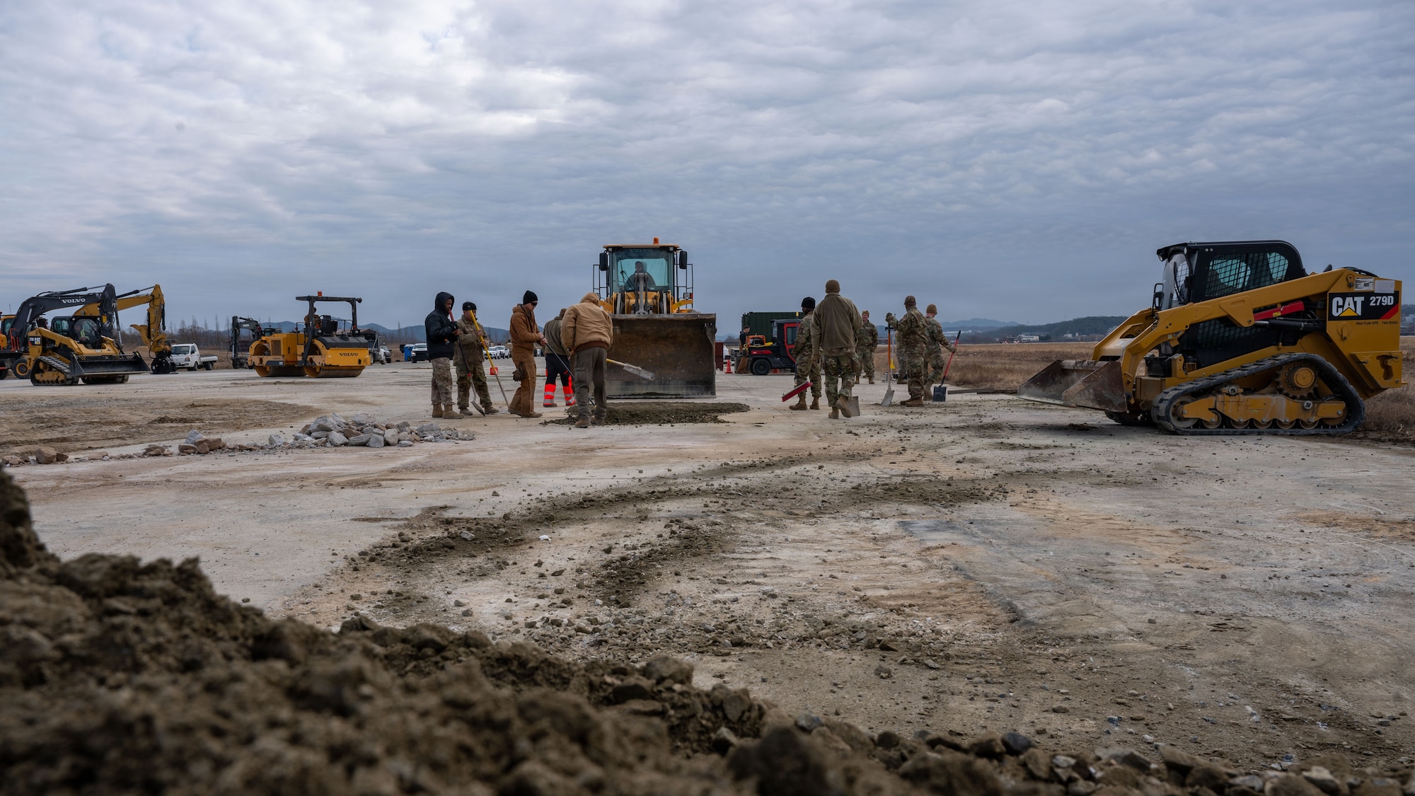 U.S. Air Force Airmen assigned to the 51st Civil Engineer Squadron remove excess debris during Rapid Osan Airfield Recovery training at Osan Air Base, Republic of Korea, Feb. 27, 2026. The panel-based technique is designed to rapidly return the runway to operational status in support of aircraft launch operations. (U.S. Air Force photo by Senior Airman Rome Bowermaster)