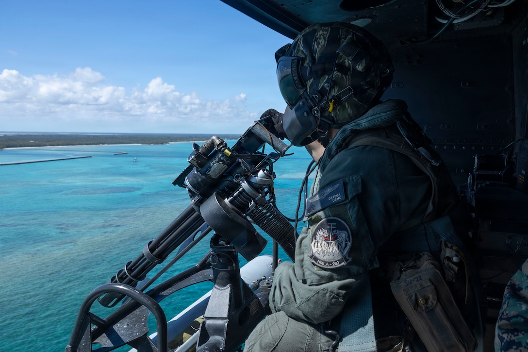 U.S. Marine Corps Sgt. Pablo Ortega, from California, a weapons and tactics crew chief instructor with Marine Light Attack Helicopter Squadron (HMLA) 269, Marine Aircraft Group 29, 2nd Marine Aircraft Wing, flies on a UH-1Y Venom during MAG-29 Distributed Aviation Operations Exercise at the U.S. Navy’s Atlantic Undersea Test and Evaluation Center, Andros Island, The Bahamas, Feb 17, 2026. MAG-29 DAO Exercise is a multi-week exercise designed to distribute command and control aviation forces, pushing authorities to the lowest levels while keeping forces moving between airfields and air sites. MAG-29 DAO is set to take place across the southeastern U.S. and the Caribbean, including North Carolina, South Carolina, Georgia, Florida and The Bahamas. (U.S. Marine Corps photo by Lance Cpl. Bryan Giraldo)