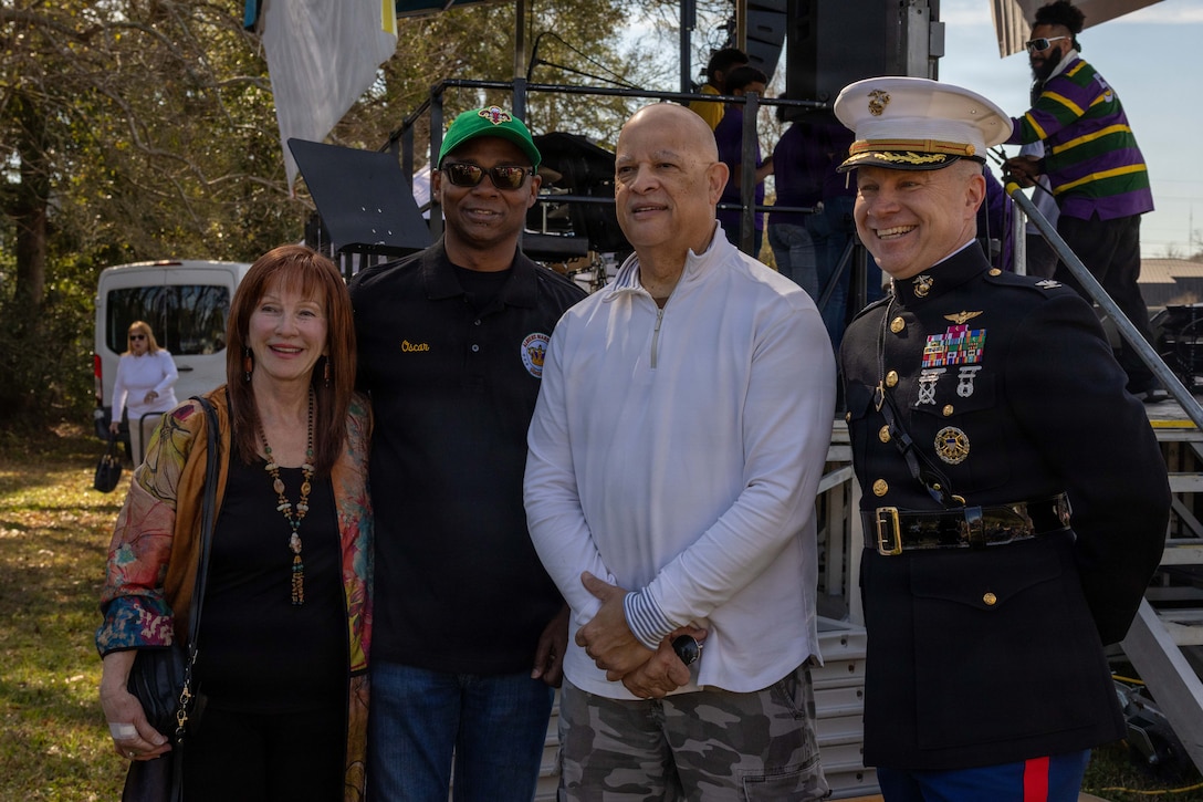U.S. Marine Corps Col. Michael Brennan, chief of staff, Marine Forces Reserve, poses for a photo with representatives of the Algiers Mardi Gras Festival in New Orleans, Feb. 28, 2026. The Algiers Point neighborhood in New Orleans has served as the headquarters of MFR since 2011. The Algiers Mardi Gras Festival is a celebration designed to unite diverse organizations and foster a strong sense of community. (U.S. Marine Corps photo by Lance Cpl. Edward Spears)