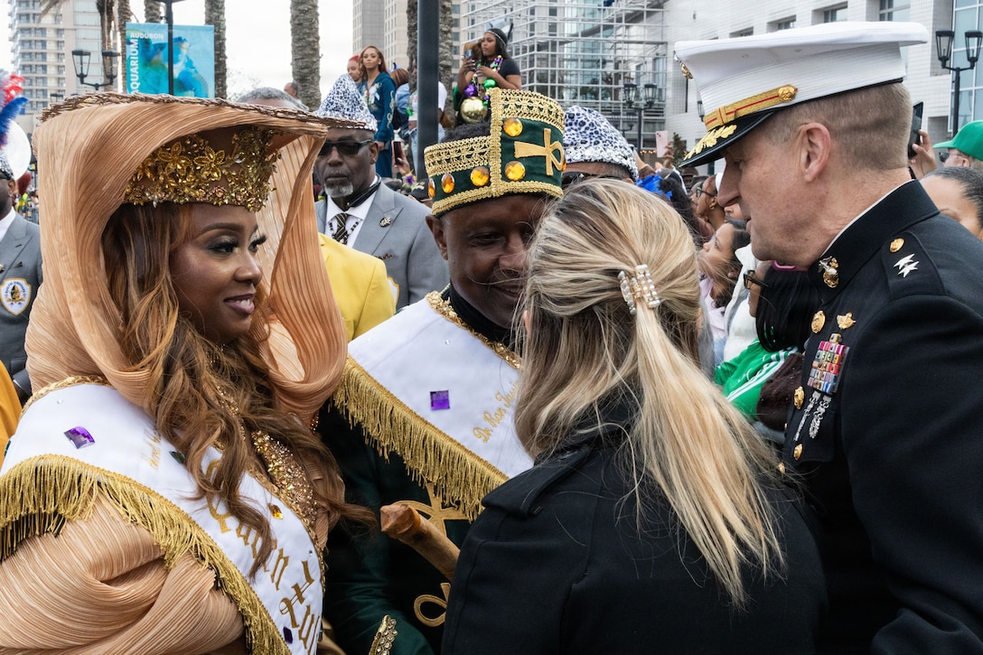 U.S. Marine Corps Maj. Gen. Douglas Clark, deputy commander of Marine Forces Reserve and Marine Forces South, and his wife Mrs. Valerie Clark, greet the 2026 Zulu King, Dr. Ron Tassin, and the 2026 Zulu Queen, Ms. Sharell Monique Chatman, during Lundi Gras Festival at Woldenberg Park, Feb. 16, 2026. Maj. Gen. Clark celebrated Lundi Gras with the Zulu Social Aid and Pleasure Club, emphasizing the tradition and long-standing partnership built over the years. (U.S. Marine Corps photo by Sgt. Emily De La Torre)