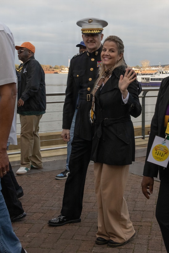 U.S. Marine Corps Maj. Gen. Douglas Clark, deputy commander of Marine Forces Reserve and Marine Forces South, and his wife Mrs. Valerie Clark, join the crowd of revelers during Lundi Gras Festival at Woldenberg Park, Feb. 16, 2026. Maj. Gen. Clark celebrated Lundi Gras with the Zulu Social Aid and Pleasure Club, emphasizing the tradition and long-standing partnership built over the years. (U.S. Marine Corps photo by Sgt. Emily De La Torre)