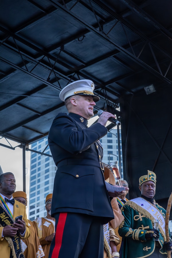 U.S. Marine Corps Maj. Gen. Douglas Clark, deputy commander of Marine Forces Reserve and Marine Forces South, speaks to the crowd during Lundi Gras Festival at Woldenberg Park, New Orleans, Feb. 16, 2026. Maj. Gen. Clark celebrated Lundi Gras with the Zulu Social Aid and Pleasure Club, emphasizing the tradition and long-standing partnership built over the years. (U.S. Marine Corps photo by Sgt. Emely Gonzalez)