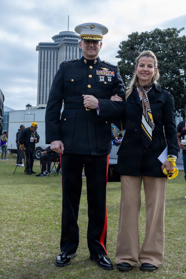 U.S. Marine Corps Maj. Gen. Douglas Clark, deputy commander of Marine Forces Reserve and Marine Forces South, poses for a photo with his wife Mrs. Valerie Clark during Lundi Gras Festival at Woldenberg Park, Feb. 16, 2026. Maj. Gen. Clark celebrated Lundi Gras with the Zulu Social Aid and Pleasure Club, emphasizing the tradition and long-standing partnership built over the years. (U.S. Marine Corps photo by Sgt. Emely Gonzalez)