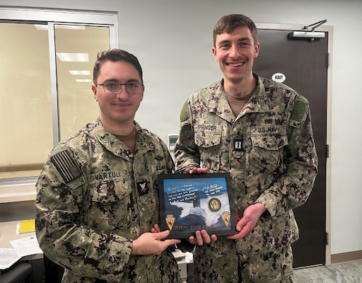 251201-N-OV429-1001 KITTERY, Maine (01 Dec. 2025) – Lt. Jacob Springer and Hospital Corpsman 2nd Class Tyler Vartuli are recognized by the Commanding Officer, Cmdr. Mark Rostedt of the USS Cheyenne (SSN 773), a Los Angeles-class attack submarine, for their critical role in the submarine's successful return to the Fleet. As Navy Medicine personnel from Navy Medicine Readiness and Training Command (NMRTC) New England, their work at the DHA-supported Naval Branch Health Clinic Portsmouth exemplifies the powerful interoperability that directly generates warfighting readiness for the nation's silent service. (U.S. Navy Photo by Cmdr. Jenny Paul).