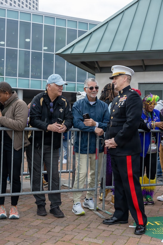 U.S. Marine Corps Maj. Gen. Douglas Clark, deputy commander of Marine Forces Reserve and Marine Forces South, speaks with members of the crowd during Lundi Gras Festival at Woldenberg Park, New Orleans, Feb. 16, 2026. Maj. Gen. Clark celebrated Lundi Gras with the Zulu Social Aid and Pleasure Club, emphasizing the tradition and long-standing partnership built over the years. (U.S. Marine Corps photo by Sgt. Emely Gonzalez)