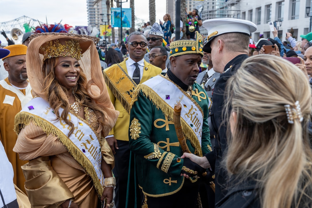 U.S. Marine Corps Maj. Gen. Douglas Clark, deputy commander of Marine Forces Reserve and Marine Forces South, greets the 2026 Zulu King, Dr. Ron Tassin, during Lundi Gras Festival at Woldenberg Park, New Orleans, Feb. 16, 2026. Maj. Gen. Clark celebrated Lundi Gras with the Zulu Social Aid and Pleasure Club, emphasizing the tradition and longstanding partnership built over the years. (U.S. Marine Corps photo by Sgt. Emely Gonzalez)