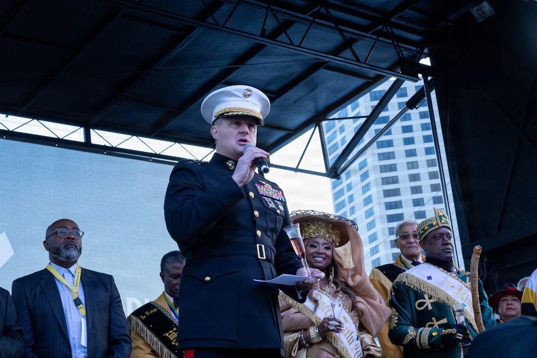 U.S. Marine Corps Maj. Gen. Douglas Clark, deputy commander of Marine Forces Reserve and Marine Forces South, speaks to the crowd during Lundi Gras Festival at Woldenberg Park, New Orleans, Feb. 16, 2026. Maj. Gen. Clark celebrated Lundi Gras with the Zulu Social Aid and Pleasure Club, emphasizing the tradition and long-standing partnership built over the years. (U.S. Marine Corps photo by Sgt. Emely Gonzalez)
