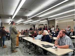 260219-N-OV429-1001 KITTERY, Maine (19 Feb 2026) – Before a mass casualty drill, Command drill coordinator, Hospital Corpsman 2nd Class James Hickey assigned to Navy Medicine Readiness and Training Unit provides refresher training to staff who work at the Naval hospital clinic. The drill was designed to sharpen the team's response to potential shipyard or submarine emergencies, a core component of the command's readiness mission . (U.S. Navy Photo by Cmdr. Jenny Paul)