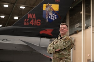 a person stands in front of a plane