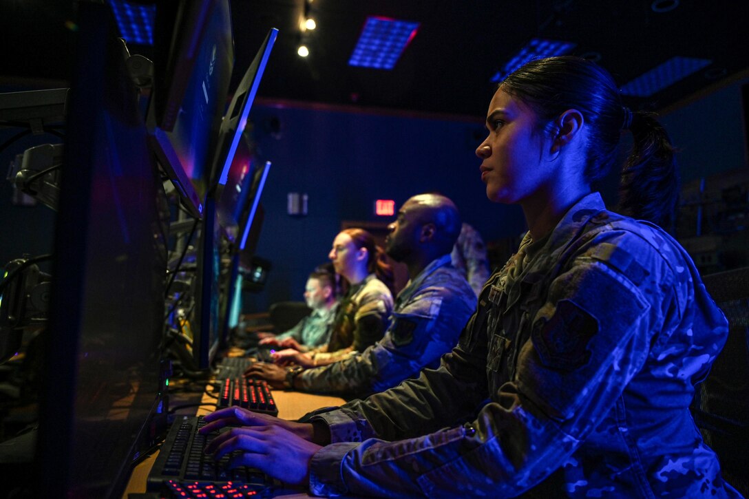 U.S. Air Force Airmen with the 67th Cyberspace Wing's 367th Cyberspace Operations Squadron prepare for daily mission tasks at Joint Base San Antonio-Lackland, March 31, 2025. The Airmen of the 67th Cyberspace Wing remain at the ready to defend in the nation against any cyber threat. (U.S. Air Force photo by Jantzen Floate)