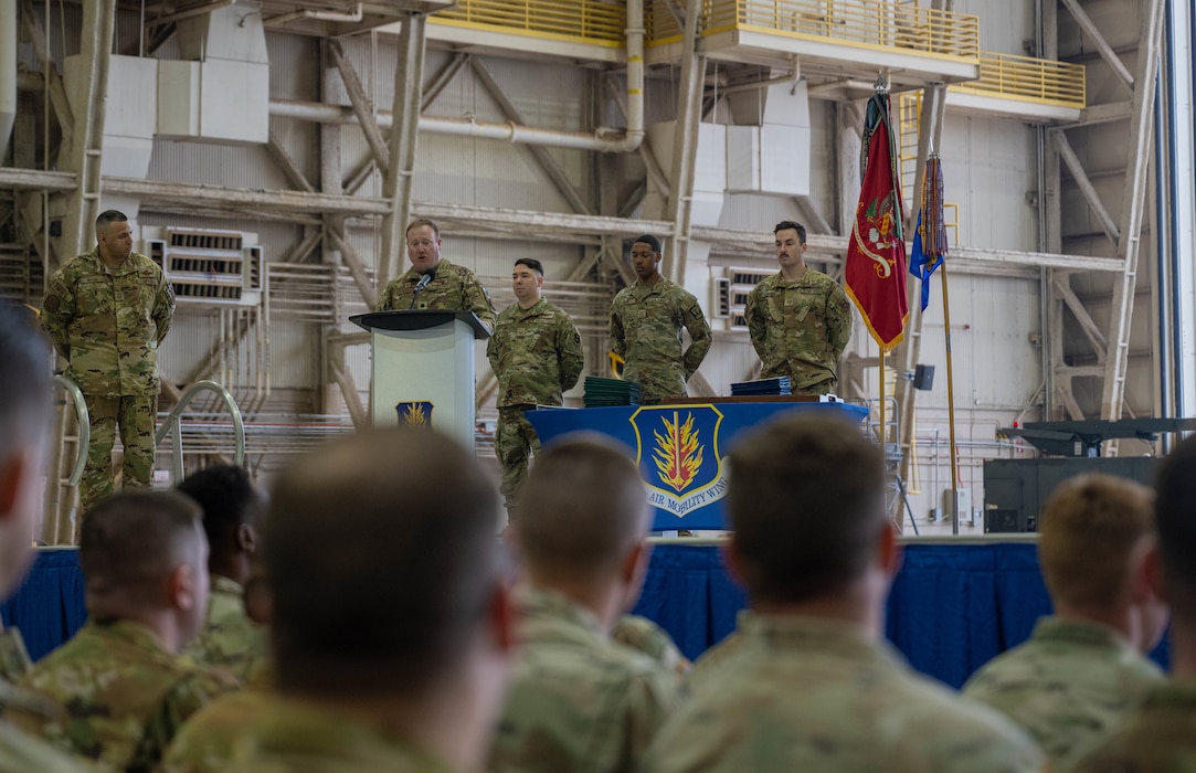 U.S. Air Force Lt. Col. Jonathan Taylor, 58th Airlift Squadron commander, speaks during a Joint Medals Ceremony at Altus Air Force Base, Oklahoma, March 4, 2026. By integrating Soldiers into realistic loading operations, Airmen sharpened their own skills on loading a variety of Army combat vehicles while also ensuring the 5-5 Air Defense Artillery Battalion, assigned to Fort Sill, had the knowledge and understanding to safely deploy their equipment by air. (U.S. Air Force photo by Airman 1st Class Emma Wright)