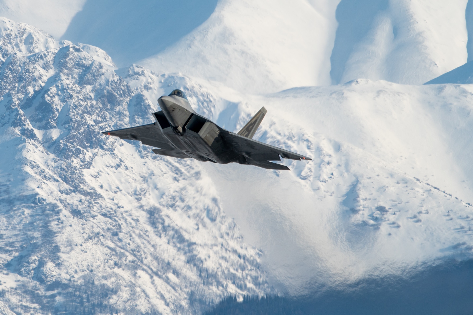 A U.S. Air Force F-22 Raptor aircraft assigned to the 3rd Wing takes off during a routine training sortie at Joint Base Elmendorf-Richardson, Alaska, Feb. 20, 2026. The F-22 maintains unmatched maneuverability ensuring the U.S. can outmatch any aircraft in the high-altitude Arctic environment. (U.S. Air Force photo by Airman 1st Class Theodore Gowdy)