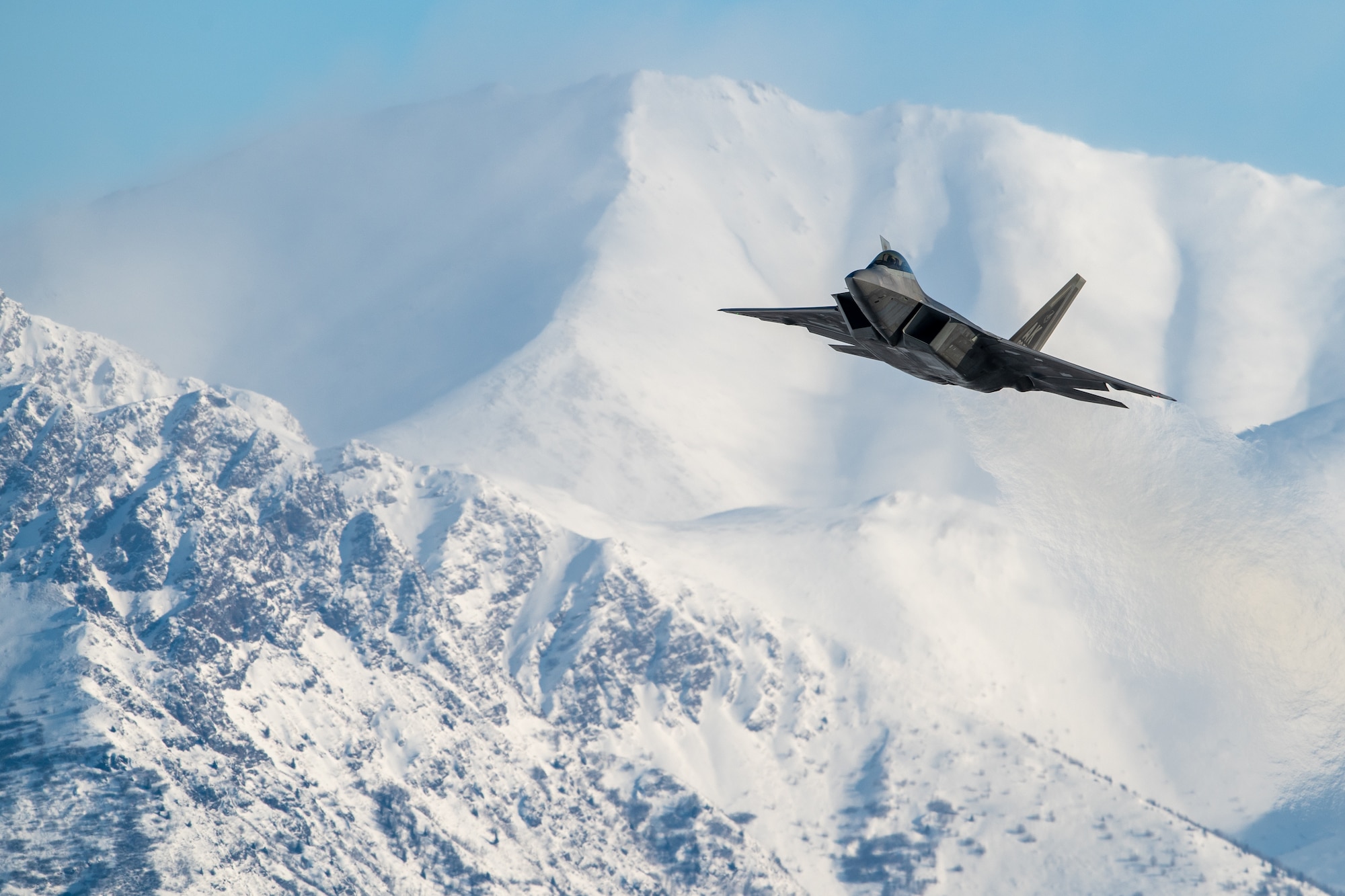 A U.S. Air Force F-22 Raptor aircraft assigned to the 3rd Wing takes off during a routine training sortie at Joint Base Elmendorf-Richardson, Alaska, Feb. 20, 2026. As a premier fifth-generation stealth asset, the F-22’s low-observable technology allows it to patrol the Arctic skies undetected, providing superior strike capability against potential threats to the Arctic region. (U.S. Air Force photo by Airman 1st Class Theodore Gowdy)