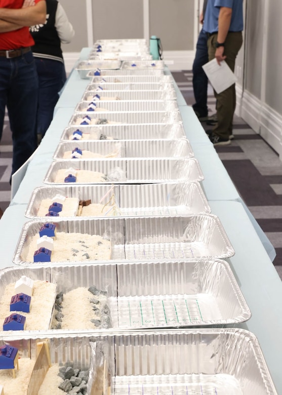 Students display their completed shoreline protection designs following the coastal engineering challenge at the 24th Annual Engineering Career Day Feb. 27, 2026, in Jacksonville, Florida. Each team developed unique solutions using provided materials to demonstrate how coastal structures can reduce erosion and protect vulnerable infrastructure. (U.S. Army Corps of Engineers photo by Public Affairs Specialist Misty Cunningham)