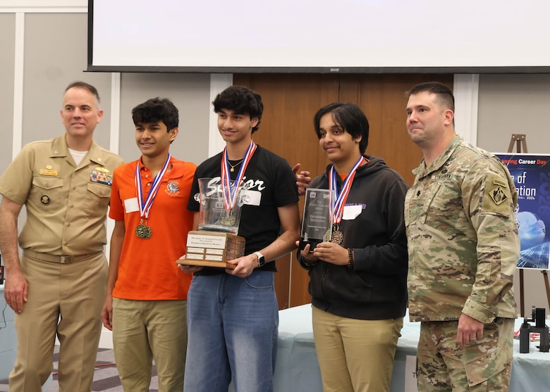 Students from The Bolles School and Creekside High School pose for a photo after receiving medals during the awards ceremony at the 24th Annual Engineering Career Day Feb. 27, 2026, in Jacksonville, Florida. Lt. Col. Matthew Westcott, deputy commander of the U.S. Army Corps of Engineers Jacksonville District, presented medals alongside U.S. Navy leadership recognizing student achievements in engineering design and teamwork. (U.S. Army Corps of Engineers photo by PublicAffairs Specialist Misty Cunningham)