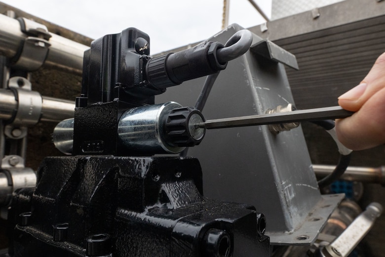 A close up image of a four-way valve.