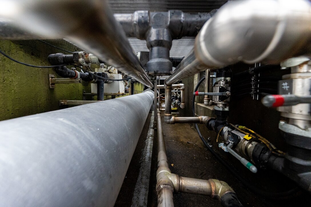 Pipes on the interior of a concrete structure.