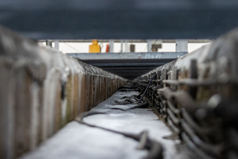 Icy interior of a concrete trench.