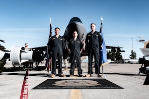 U.S. Air Force Airman 1st Class Adrian Padilla (left), Staff Sgt. Ian Brandt (middle), Airman 1st Class Kemper Evers (right), all 61st Aircraft Maintenance Unit F-35 dedicated crew chiefs, pose in front of an F-35A Lightning II during a Dedicated Crew Chief competition