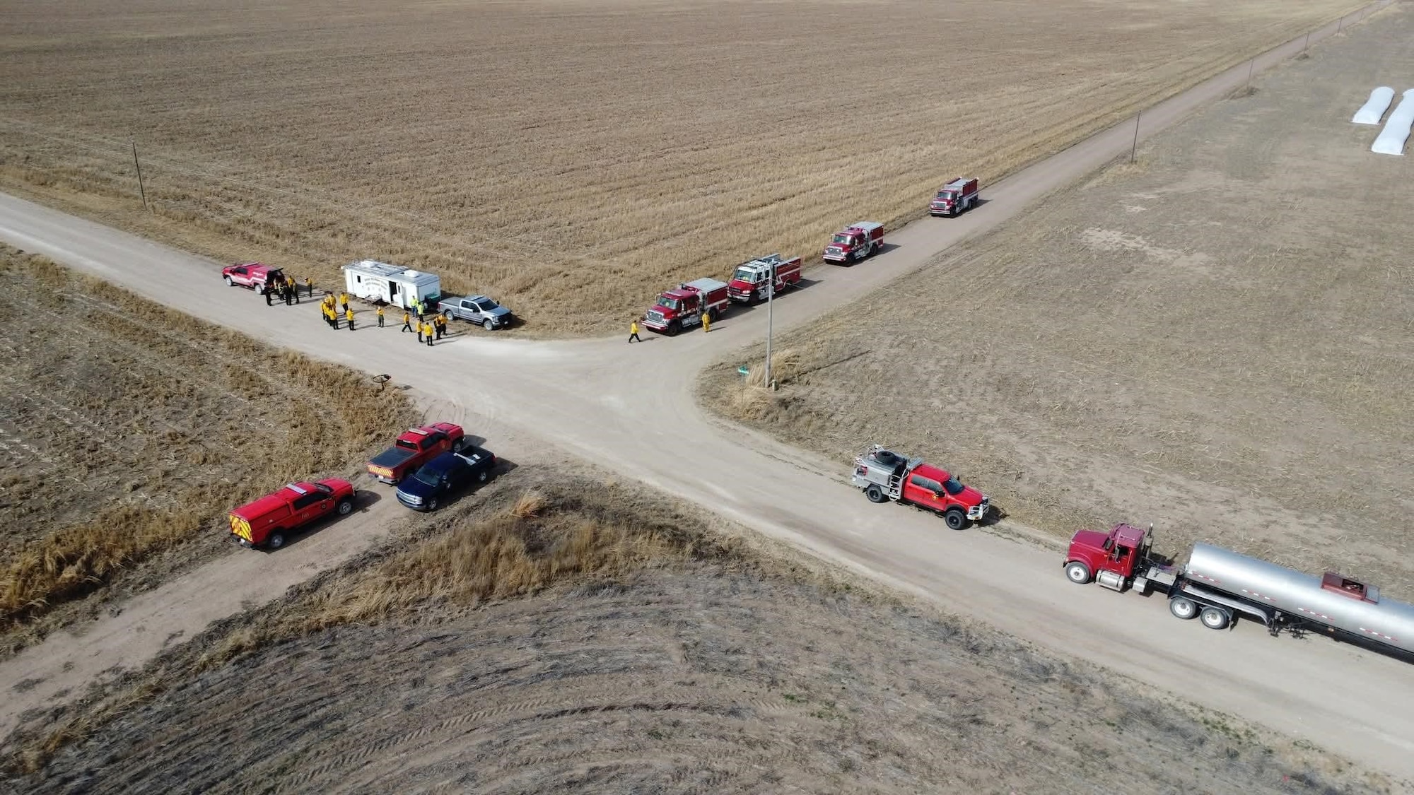 U.S. Air National Guard Tech. Sgt. Chase Garza, assigned to the 184th Wing, Kansas Air National Guard, works with a joint-service team as a crew chief to suppress a wildland fire in western Kansas, Feb. 15-20, 2026. Garza deployed as part of a Kansas National Guard task force, leading a crew of Army Soldiers and an Airman in direct attack and mop-up operations to contain the fire and prevent reignition.