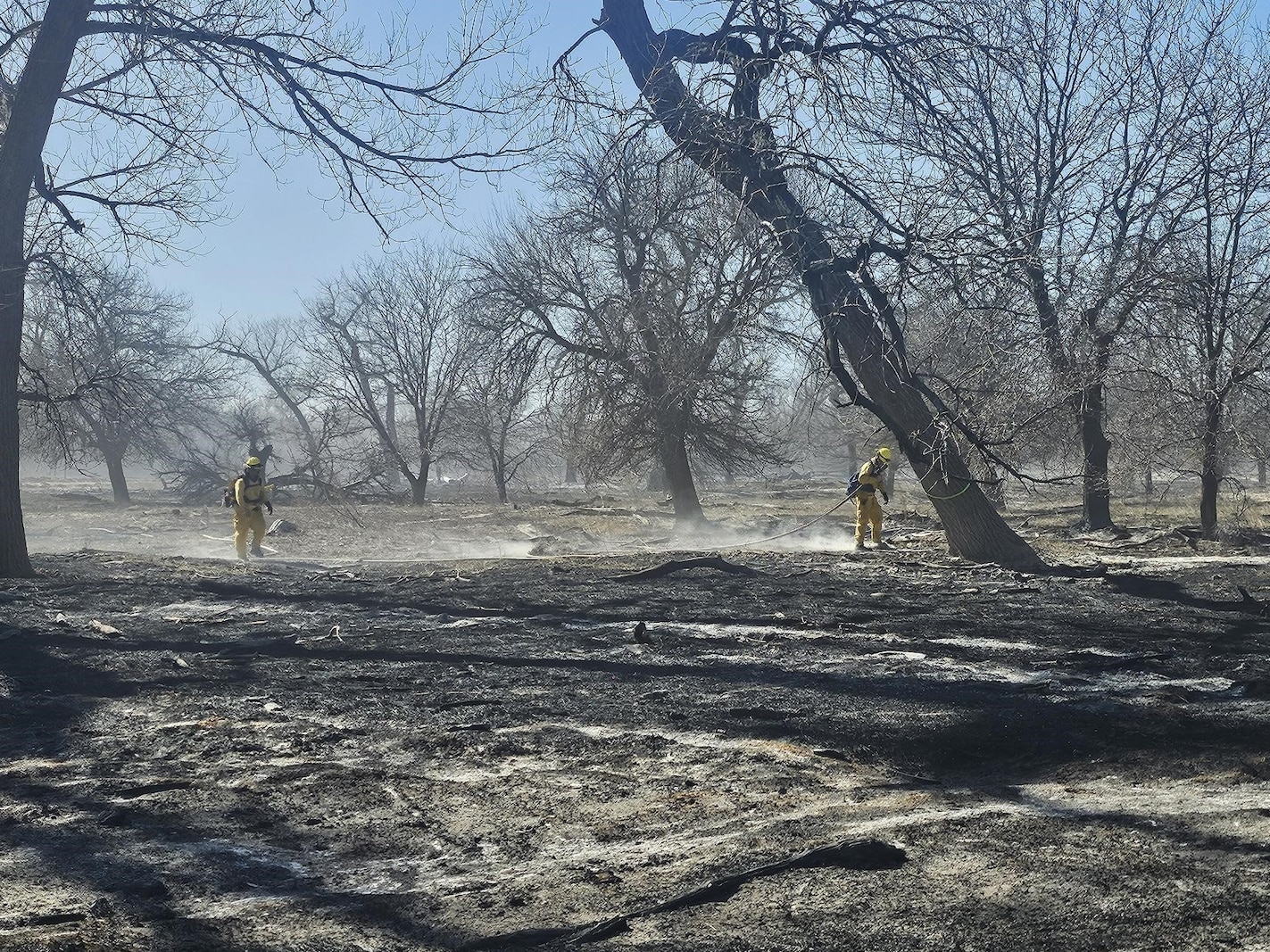 U.S. Air National Guard Tech. Sgt. Chase Garza, assigned to the 184th Wing, Kansas Air National Guard, works with a joint-service team as a crew chief to suppress a wildland fire in western Kansas, Feb. 15-20, 2026. Garza deployed as part of a Kansas National Guard task force, leading a crew of Army Soldiers and an Airman in direct attack and mop-up operations to contain the fire and prevent reignition.