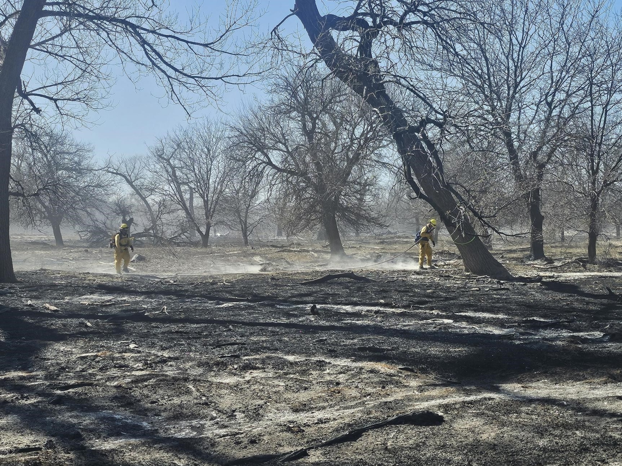 U.S. Air National Guard Tech. Sgt. Chase Garza, assigned to the 184th Wing, Kansas Air National Guard, works with a joint-service team as a crew chief to suppress a wildland fire in western Kansas, Feb. 15-20, 2026. Garza deployed as part of a Kansas National Guard task force, leading a crew of Army Soldiers and an Airman in direct attack and mop-up operations to contain the fire and prevent reignition.
