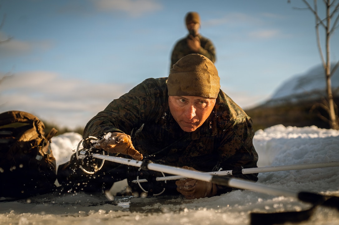 U.S. Marine Corps Maj. Gen. Farrell Sullivan, the commanding general of 2nd Marine Division, conducts the cold plunge in Setermoen, Norway, Mar. 2, 2026. The cold plunge is a part of the cold weather training that is conducted by NATO partners and allies in preparation for exercise Cold Response 26. A key component of NATO's enhanced vigilance activity Arctic Sentry, exercise Cold Response 26 is a Norwegian-led winter military exercise designed to enhance collective defense capabilities and ensure U.S. readiness to rapidly deploy and seamlessly operate alongside NATO Allies in challenging arctic conditions. (U.S. Marine Corps photo by Sgt. Noah Masog)