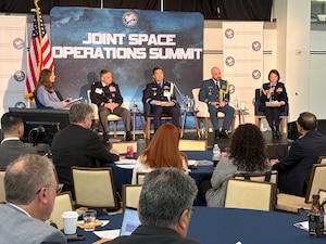 U.S. and foreign military leaders speak at a conference.