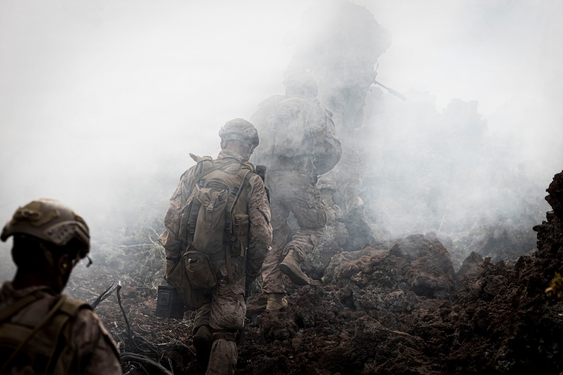 U.S. Marines with 3rd Littoral Combat Team, 3rd Marine Littoral Regiment, 3rd Marine Division, maneuver toward an objective during a live-fire training event at Pohakuloa Training Area, Hawaii, Feb. 3, 2026.