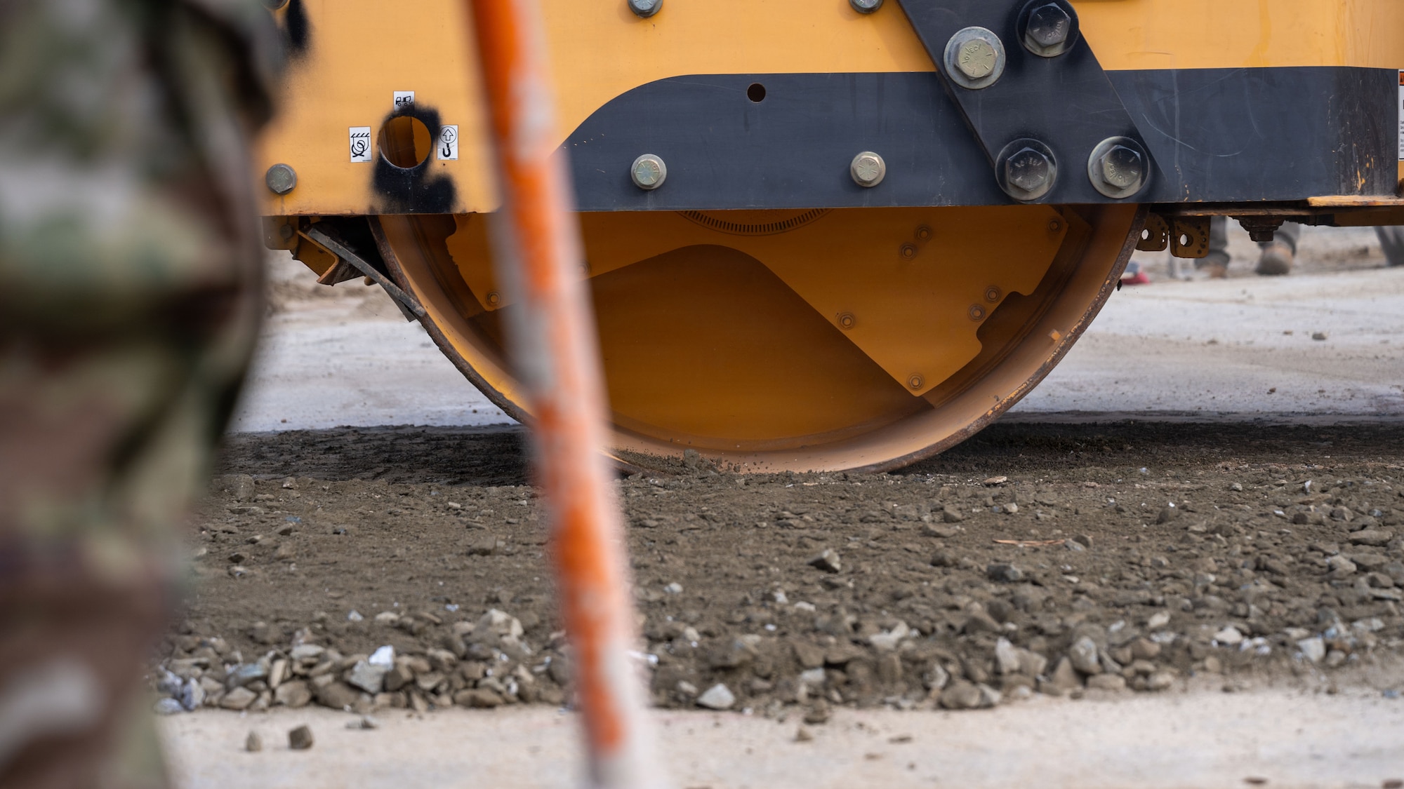 U.S. Air Force Airmen assigned to the 51st Civil Engineer Squadron flatten compact crushed stone in preparation for fiber reinforced panels to be installed during Rapid Osan Airfield Recovery training at Osan Air Base, Republic of Korea, Feb. 27, 2026. ROAR focuses on quickly restoring limited airfield capability to sustain combat airpower while follow-on repairs are implemented. (U.S. Air Force photo by Senior Airman Rome Bowermaster)