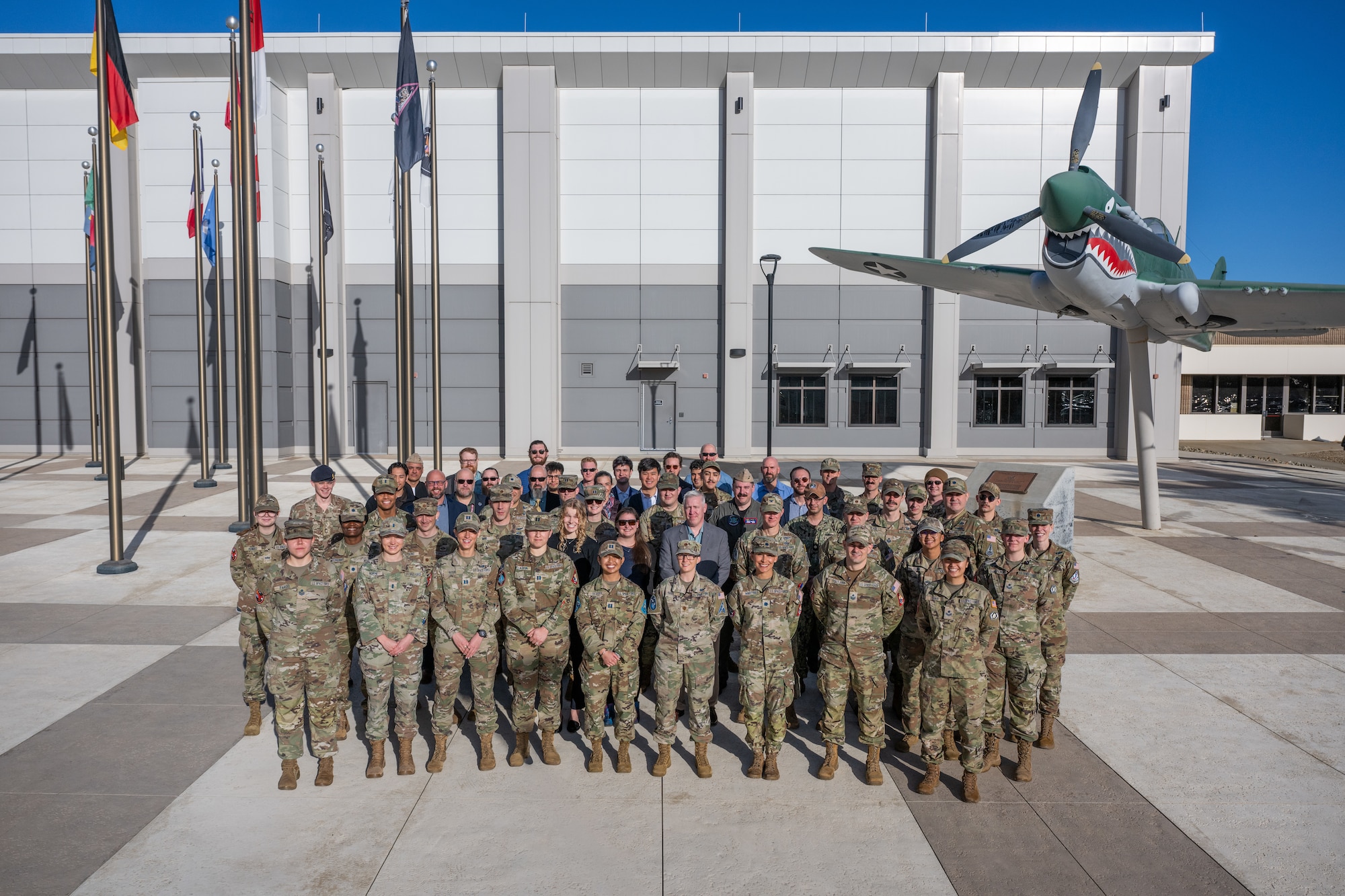 Military leaders and partners post for a group photo.