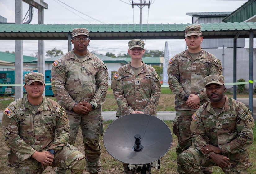U.S. Soldiers assigned to 3rd Multi-Domain Task Force pose for a group photo with a Tampa satellite aperture during Exercise Cobra Gold 2026 at U-Tapao Royal Thai Navy Airfield, Thailand, Feb. 25, 2026.