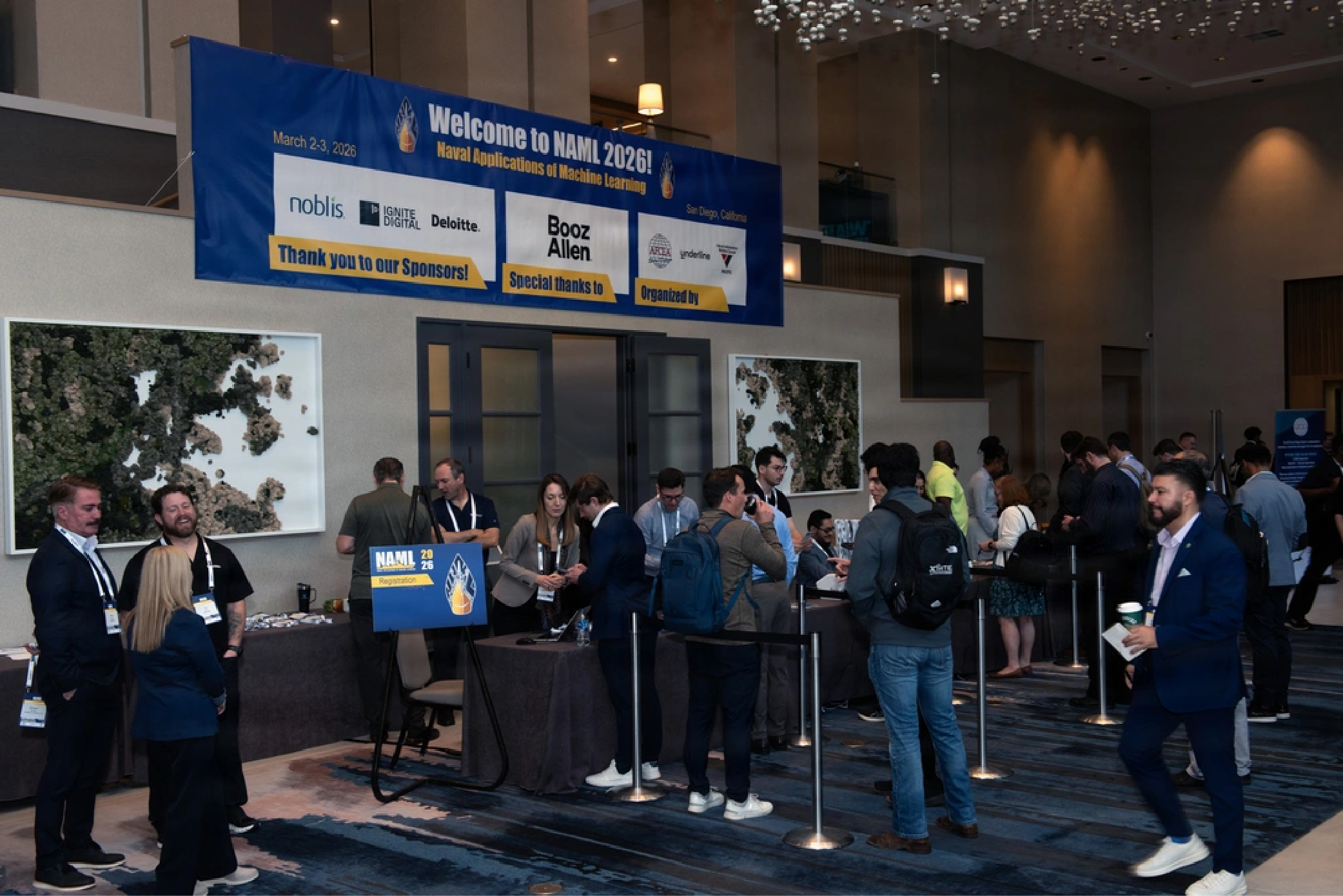 Attendees collect badges and check in for the 10th annual Naval Applications of Machine Learning workshop in San Diego, March 2, 2026