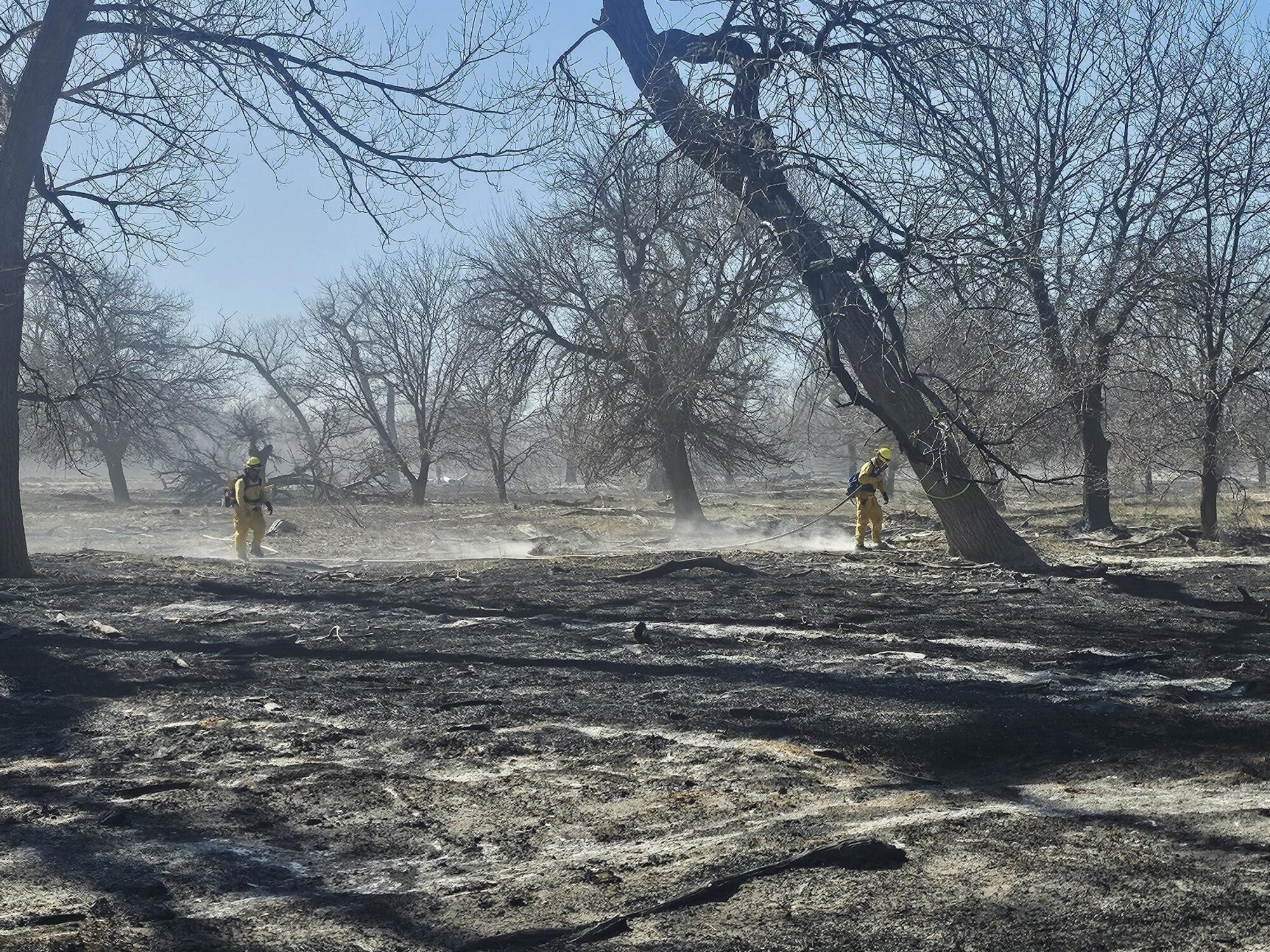 U.S. Air National Guard Tech. Sgt. Chase Garza, assigned to the 184th Wing, Kansas Air National Guard, works with a joint-service team as a crew chief to suppress a wildland fire in western Kansas, Feb. 15-20, 2026. Garza deployed as part of a Kansas National Guard task force, leading a crew of Army Soldiers and an Airman in direct attack and mop-up operations to contain the fire and prevent reignition.