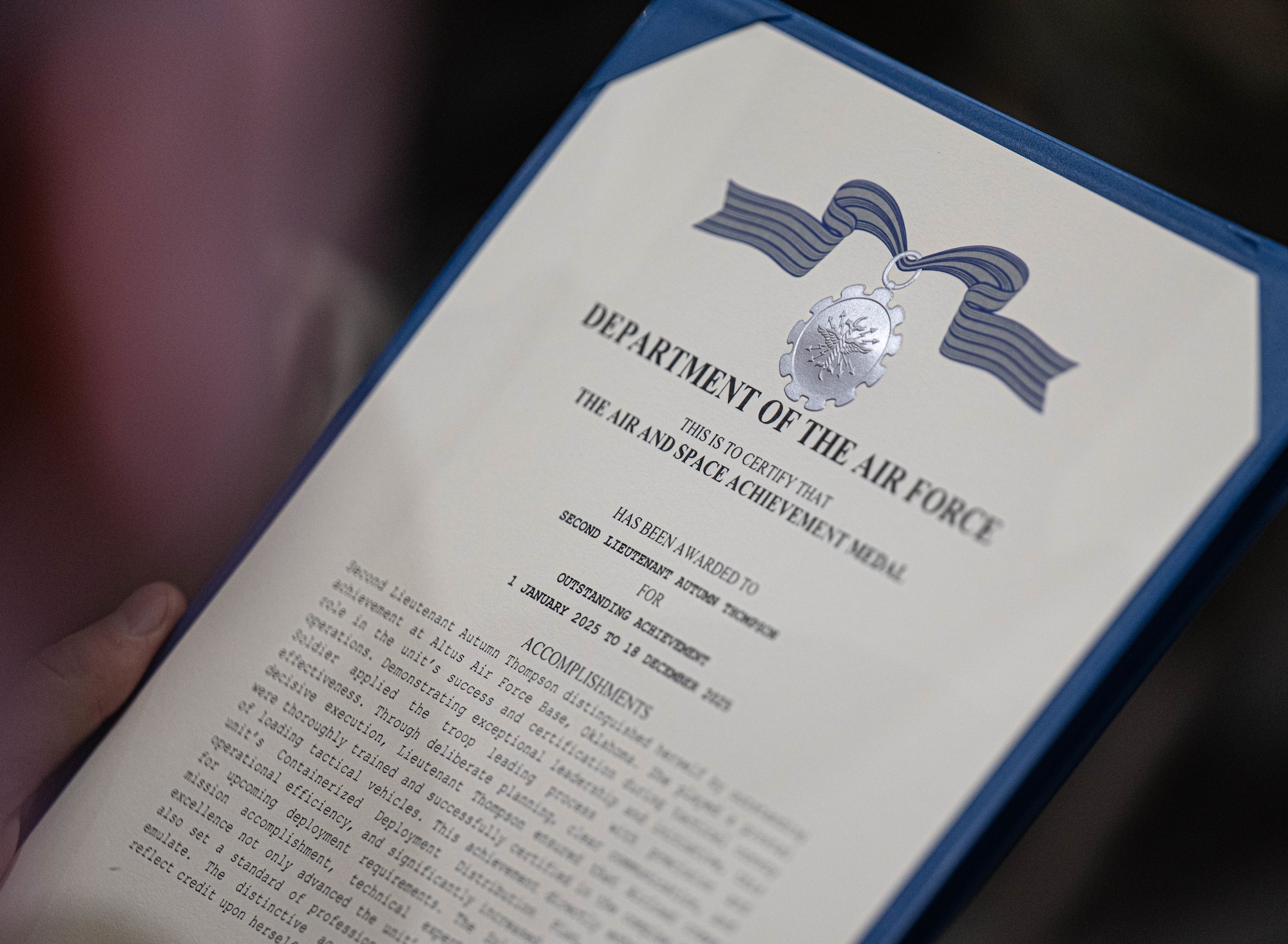 An Air and Space Achievement Medal is displayed at Altus Air Force Base, Oklahoma, March 4, 2026. As neighboring installations in Oklahoma, Altus Air Force Base and Fort Sill exemplify a unique regional representation of mutual support. (U.S. Air Force photo by Airman 1st Class Emma Wright)
