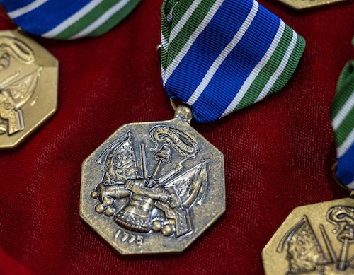 An Army Achievement Medal is displayed at Altus Air Force Base (AFB), Oklahoma, March 4, 2026. More than an exchange of medals between Altus AFB’s 58th Airlift Squadron, the 97th Logistics Readiness Squadron and the 5-5 Air Defense Artillery Battalion, assigned to Fort Sill, the ceremony honored an interservice relationship forged in sweat, precision and shared commitment to building combat-ready forces across Southwest Oklahoma and around the globe. (U.S. Air Force photo by Airman 1st Class Emma Wright)