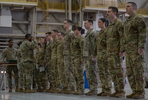 U.S. Army Lt Col. Dewayne Deener, commanding officer of the 5-5 Air Defense Artillery Battalion, pins medals on members of the 97th Logistics Readiness Squadron and 58th Airlift Squadron during a Joint Medals Ceremony at Altus Air Force Base, Oklahoma, March 4, 2026. During the ceremony, members of the 58th Airlift Squadron and the 97th Logistics Readiness Squadron were awarded the Army Achievement Medal in recognition of their support to Army training requirements. (U.S. Air Force photo by Airman 1st Class Emma Wright)