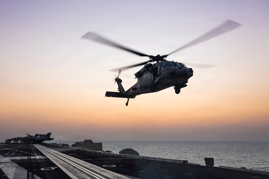 An MH-60S Sea Hawk helicopter, attached to Helicopter Sea Combat Squadron (HSC) 14, lands on the flight deck of Nimitz-class aircraft carrier USS Abraham Lincoln (CVN 72) in support of Operation Epic Fury, March. 4, 2026. (U.S. Navy photo)